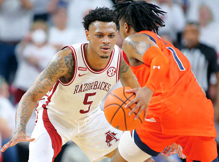 Arkansas Razorbacks guard Au'Diese Toney (5) defends against Auburn Tigers guard Wendell Green Jr. (1) at Bud Walton Arena. Arkansas won 80-76.
